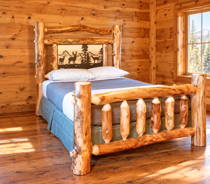 Clearwater Aspen Iron Meadow Log Bed in a rustic cabin bedroom