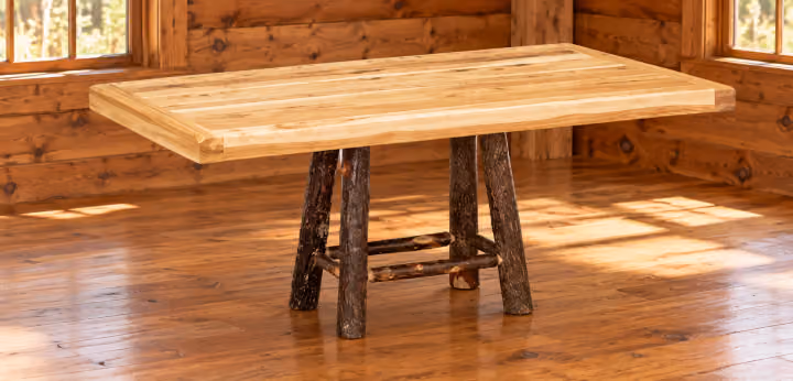 Hemlock Ridge Hickory Homestead Pedestal Dining Table in a rustic cabin dining