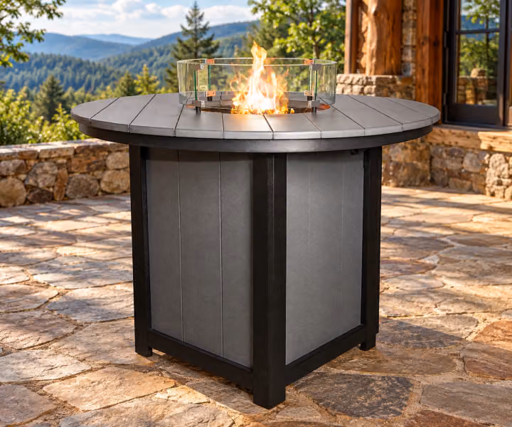 Willow Bay Poly Round Dining Fire Table in an outdoor mountain cabin setting