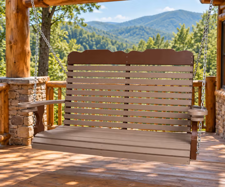 Willow Bay Poly Tall-back Swing in an outdoor mountain cabin setting
