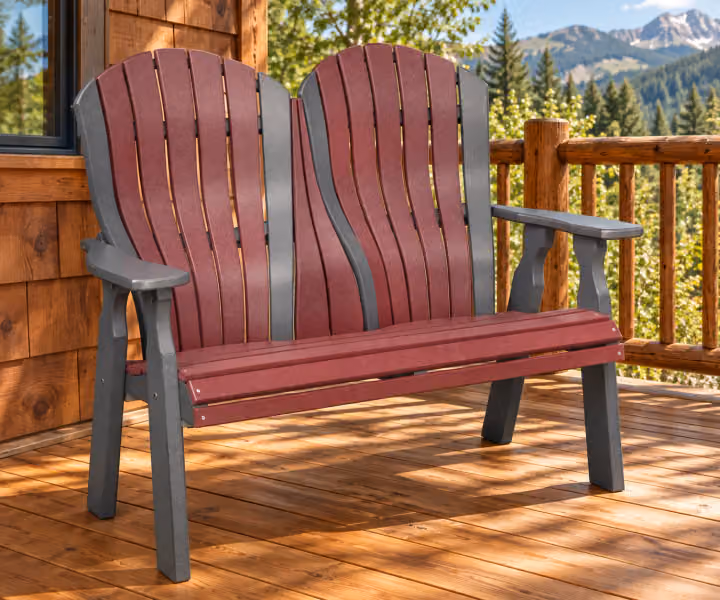 Harbor Porch Arched-back Poly Double Bench in an outdoor cabin setting