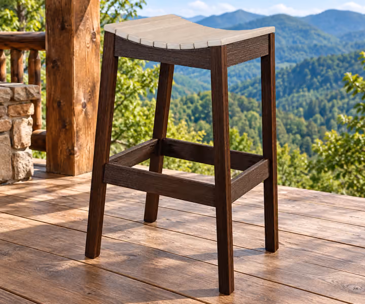 Willow Bay Poly Saddle Seat Stool in an outdoor mountain cabin setting