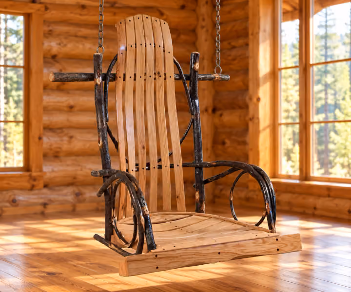 Forest Bend Hickory Rocker Porch Swing in a rustic cabin setting