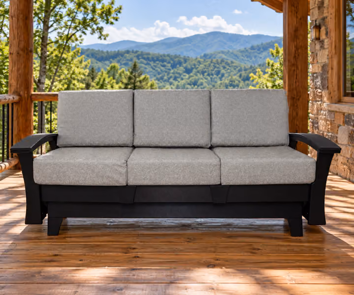 Willow Bay Poly Porchside Sofa Glider in an outdoor mountain cabin setting