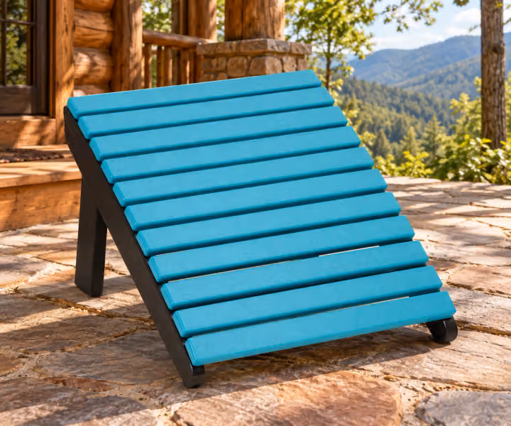 Willow Bay Poly Deck Chair Footrest in an outdoor mountain cabin setting