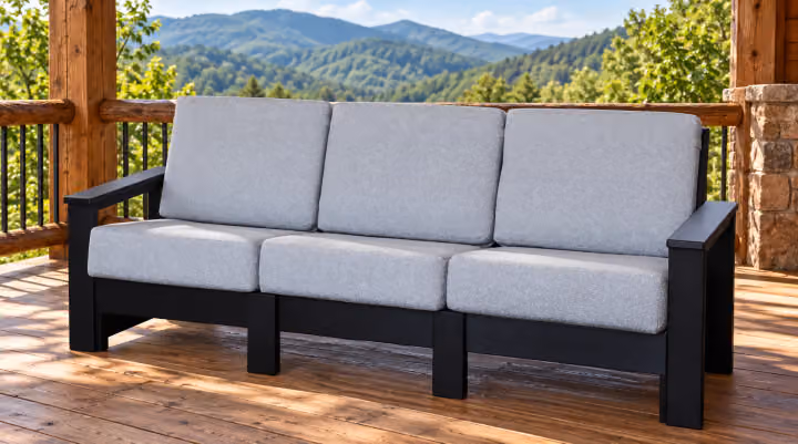 Willow Bay Poly Porchside Sofa in an outdoor mountain cabin setting