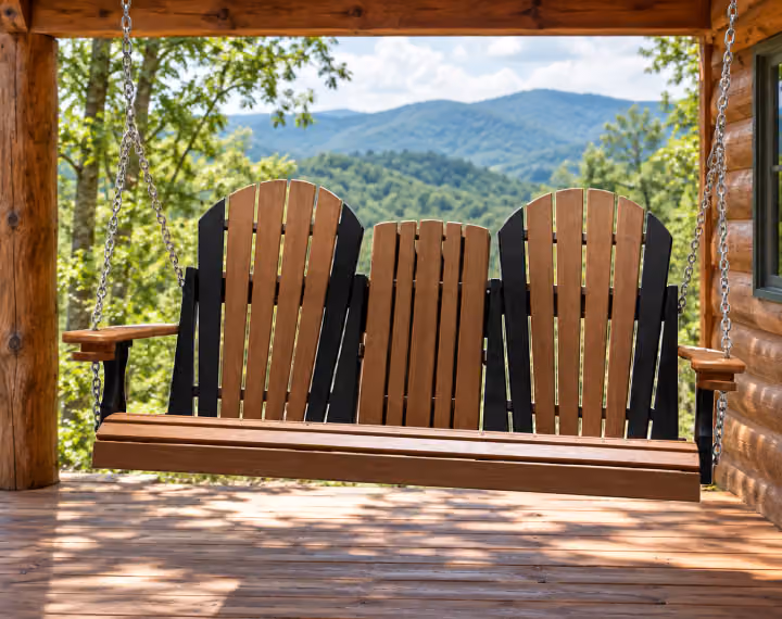 Willow Bay Poly Adirondack Swing in an outdoor mountain cabin setting