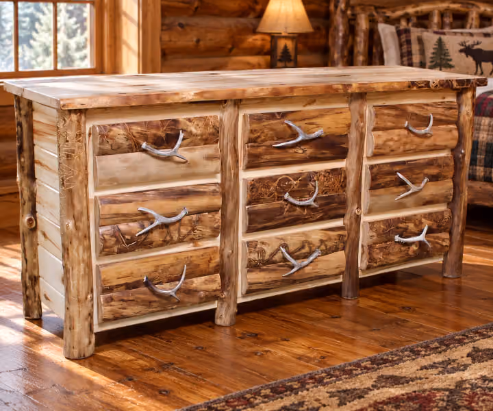 Woodland Hollow Aspen 9 Drawer Dresser in a rustic cabin bedroom