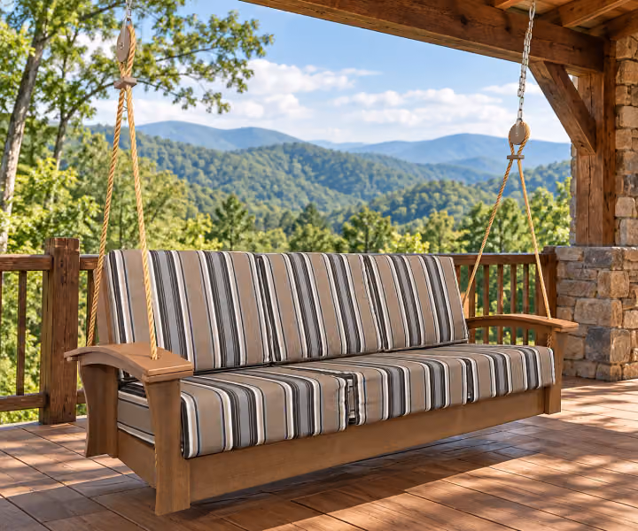 Willow Bay Poly Porchside Sofa Swing in an outdoor mountain cabin setting