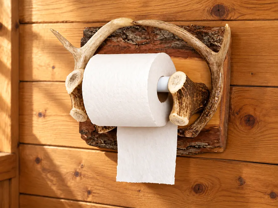 Woodland Slab Antler Paper Holder in a rustic cabin