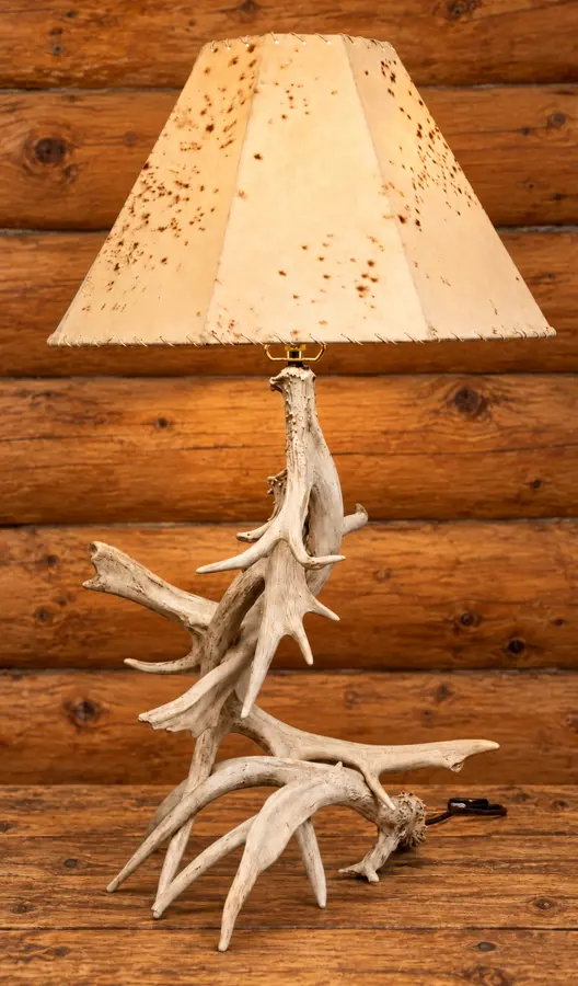 Woodland Trio Antler Table Lamp in a rustic cabin