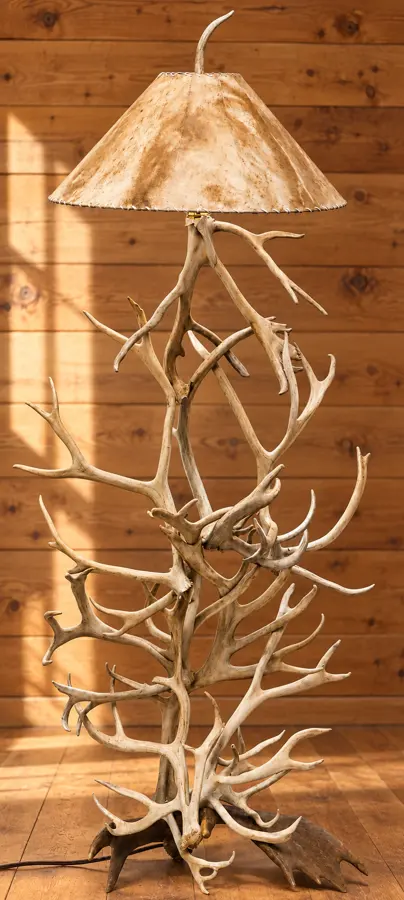 Caribou Antler Floor Lamp with Moose Base in a rustic cabin