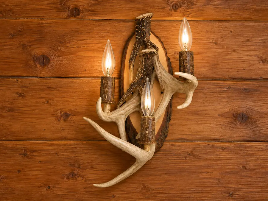 Three-Branch Antler Wall Light in a rustic cabin