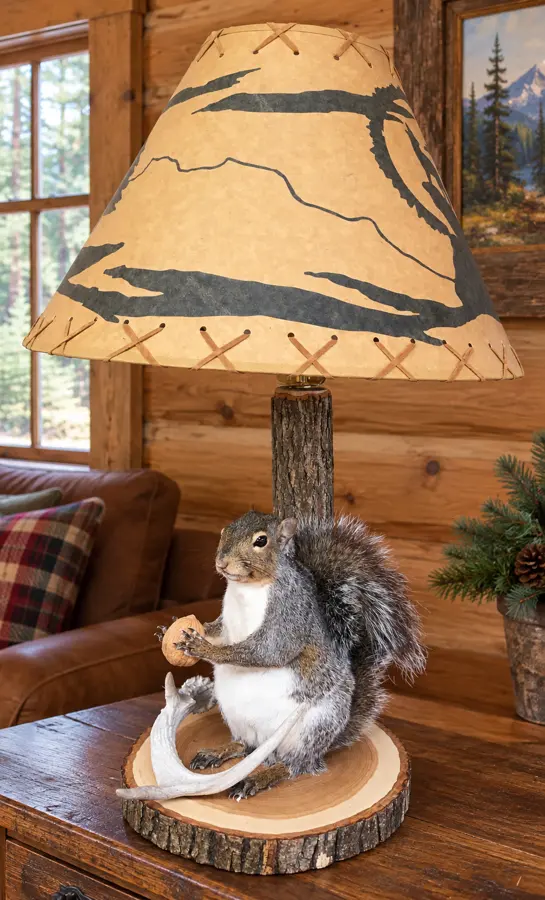 Walnut Grove Squirrel and Antler Table Lamp in a rustic cabin