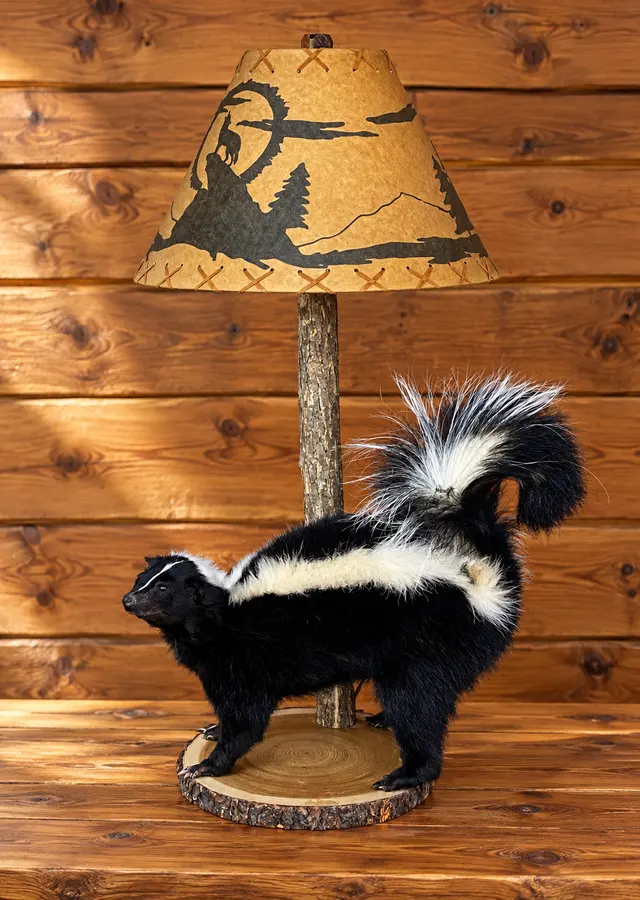 Woodland Stripe Skunk Table Lamp in a rustic cabin
